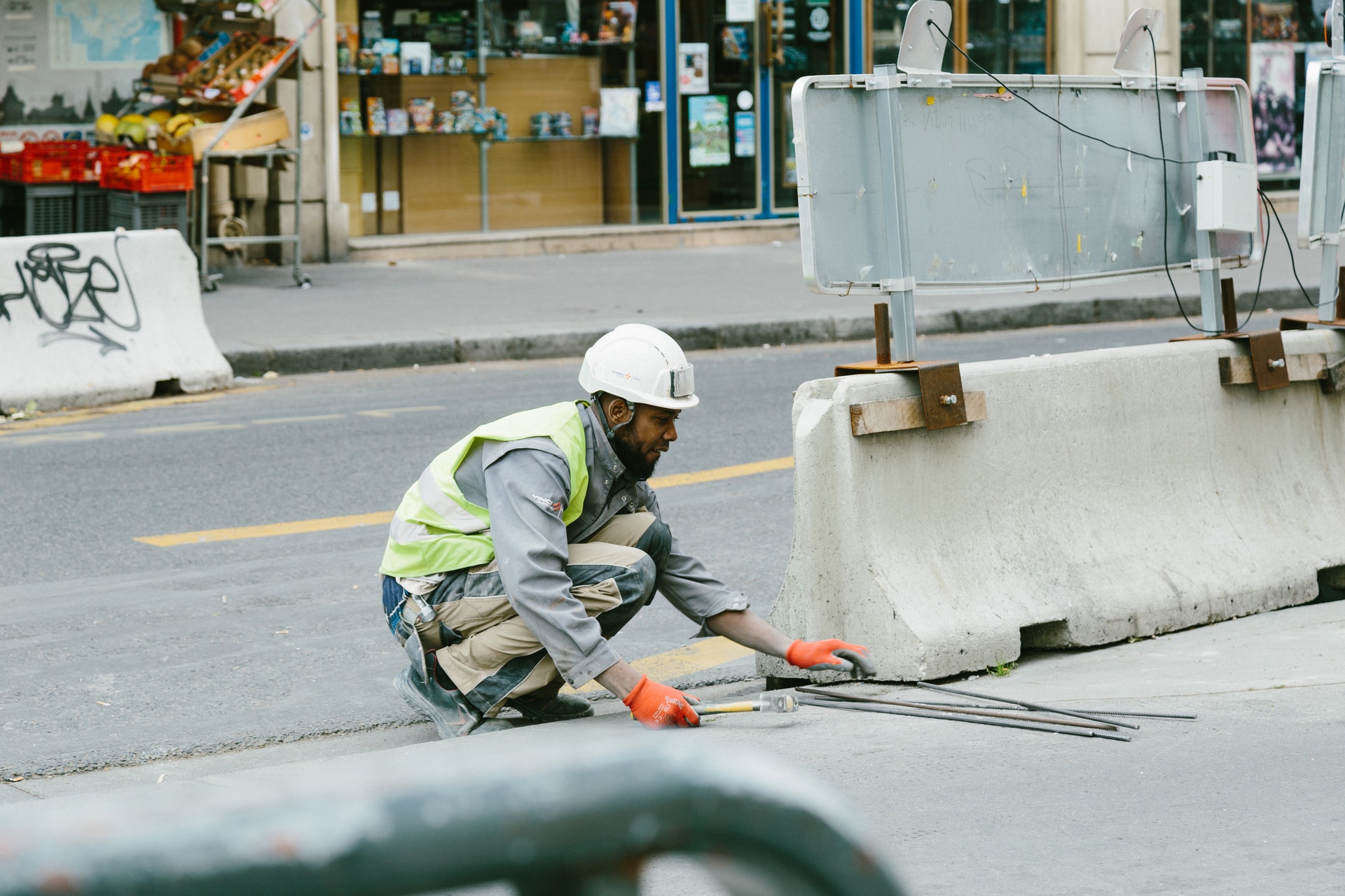 An engineer repairing a concrete barricade